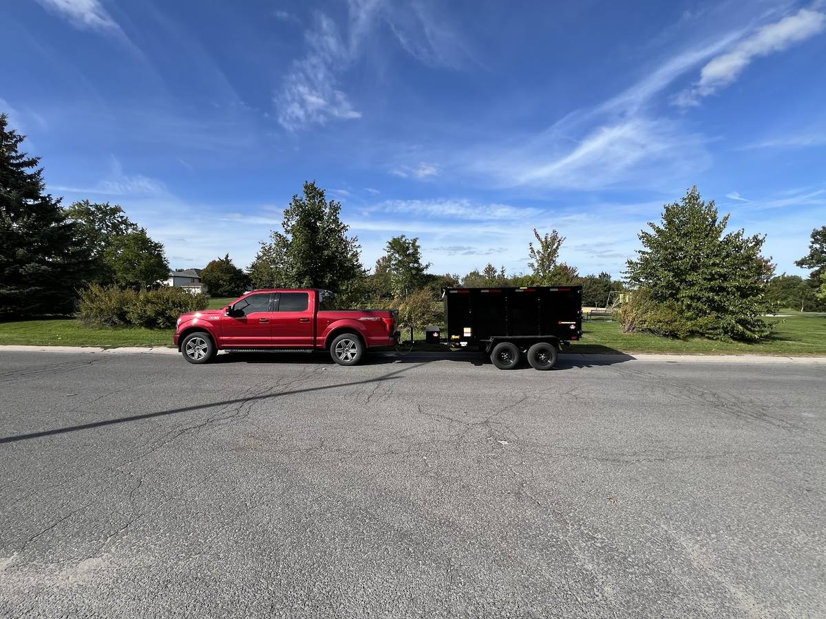 YGK Junk Solutions pickup and dump trailer serving Kingston