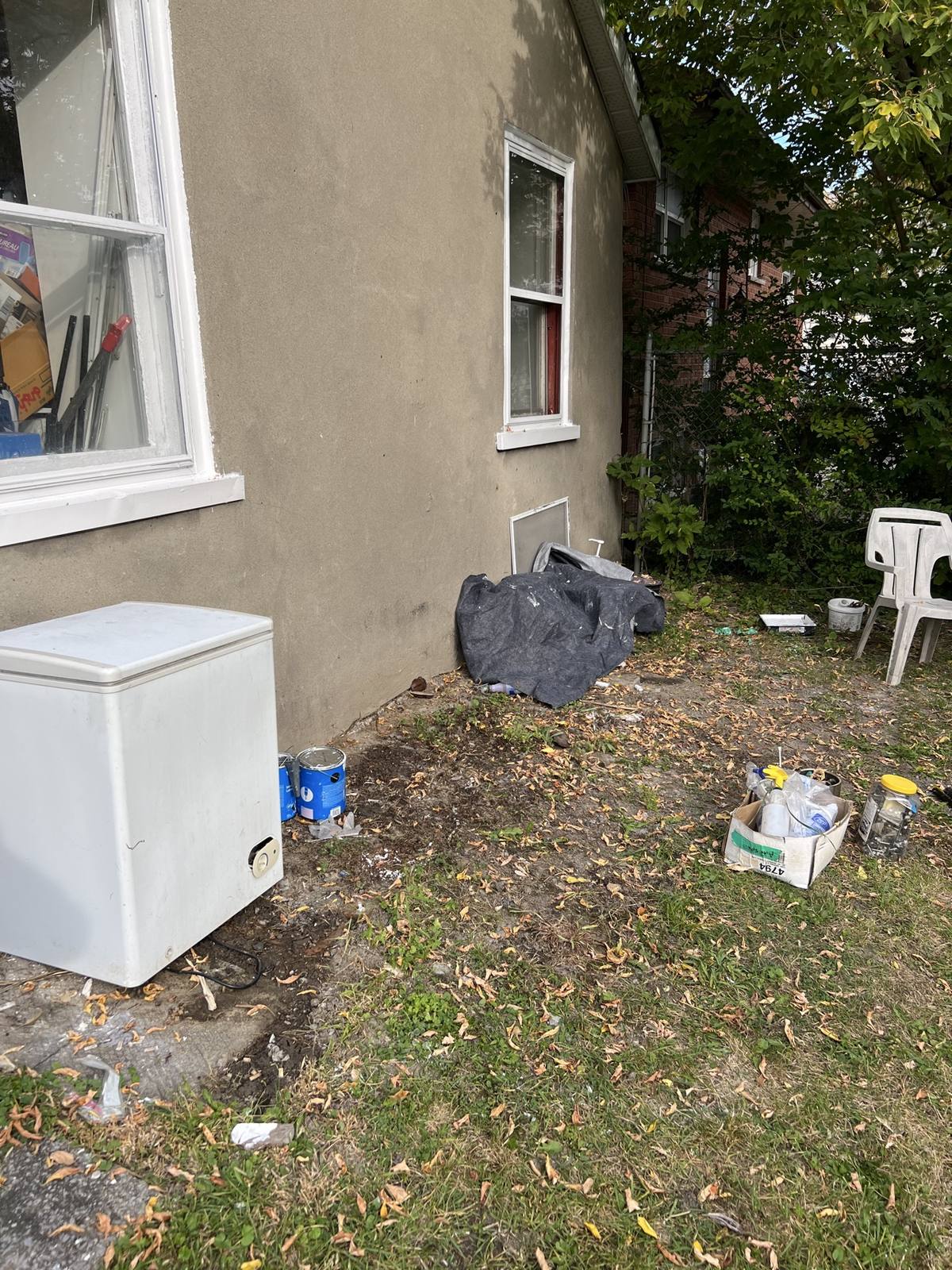 Yard partly cleared after junk removal